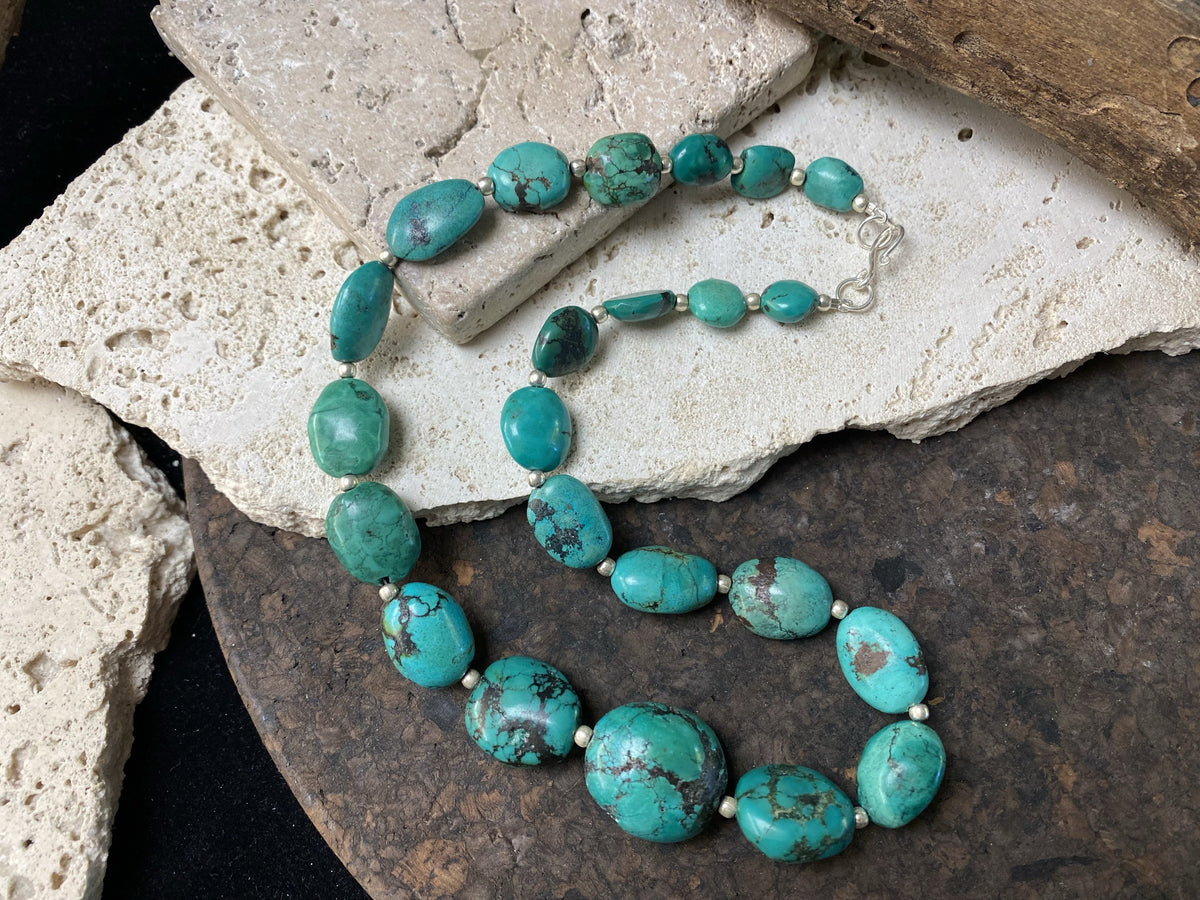 Stunning natural turquoise necklace featuring sterling silver beads and fastening. A unique tribal inspired necklace with a luxurious Boho vibe Measurements: 44 cm length including clasp