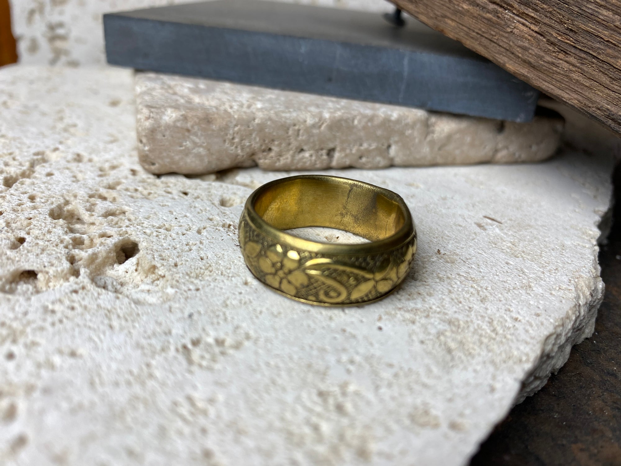 Brass ring with a simple floral band design. Suitable for either men or women