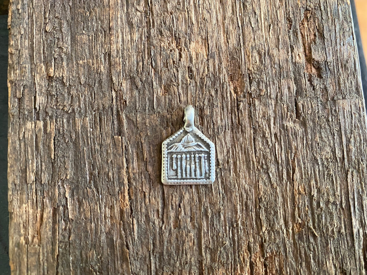 Antique silver amulets representing the Hindu god Skanda and the seven mothers, traditionally worn for protection. Early 19th - early 20th century