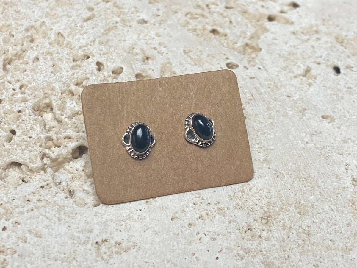 Simple and elegant, these small black onyx earring studs are hand made from sterling silver and set with onyx cabochons