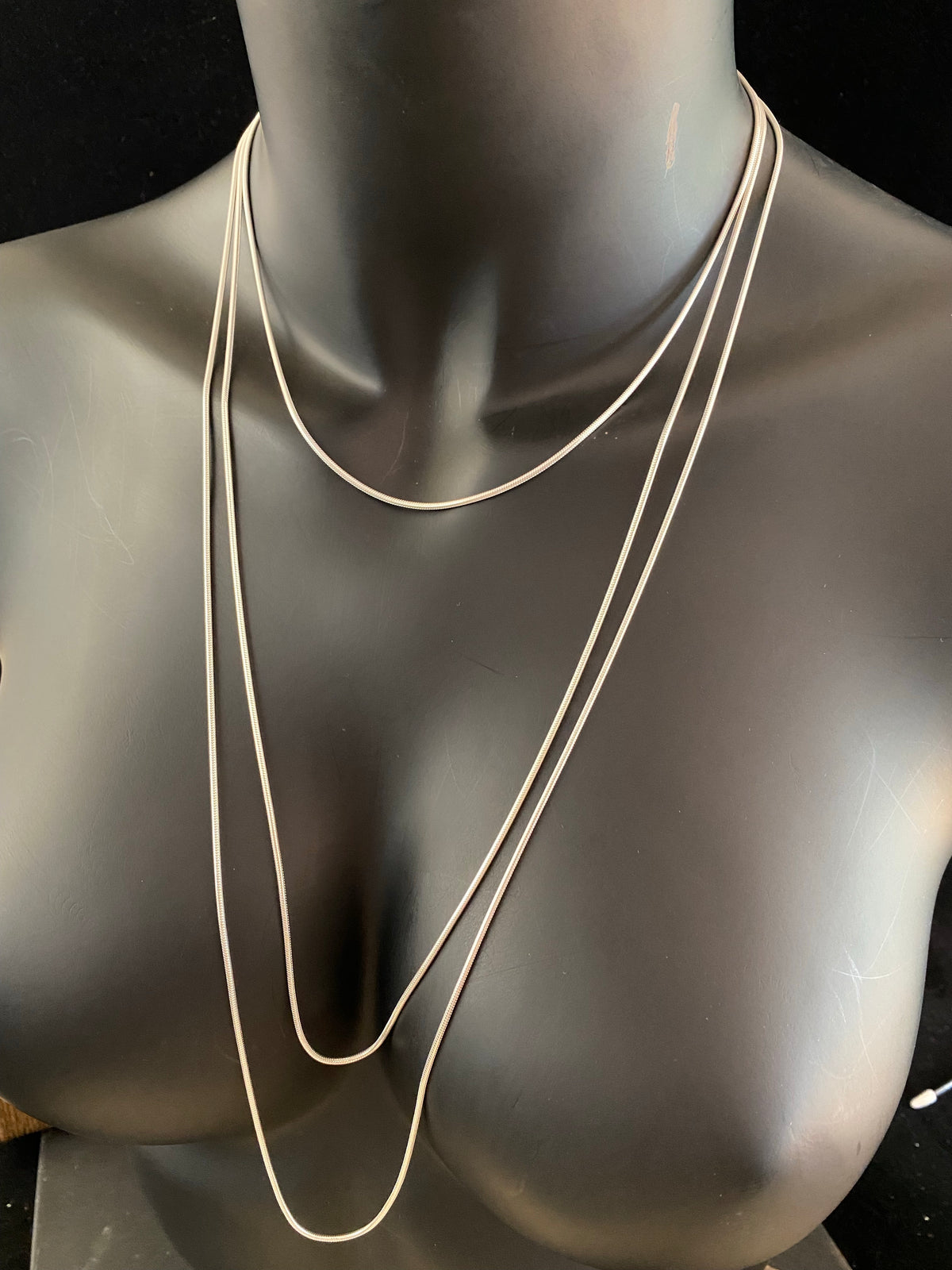 1.4 mm diameter snake chain in three lengths, these nickel-free chains are German-made from 93.5% silver and are tarnish-resistant. Our snake chain features a parrot clasp and is fitted with a narrow bail to ensure even the smallest of pendants will fit. Select Medium 45 cm/18", Long 70 cm/28" or Very long - 80 cm/32"