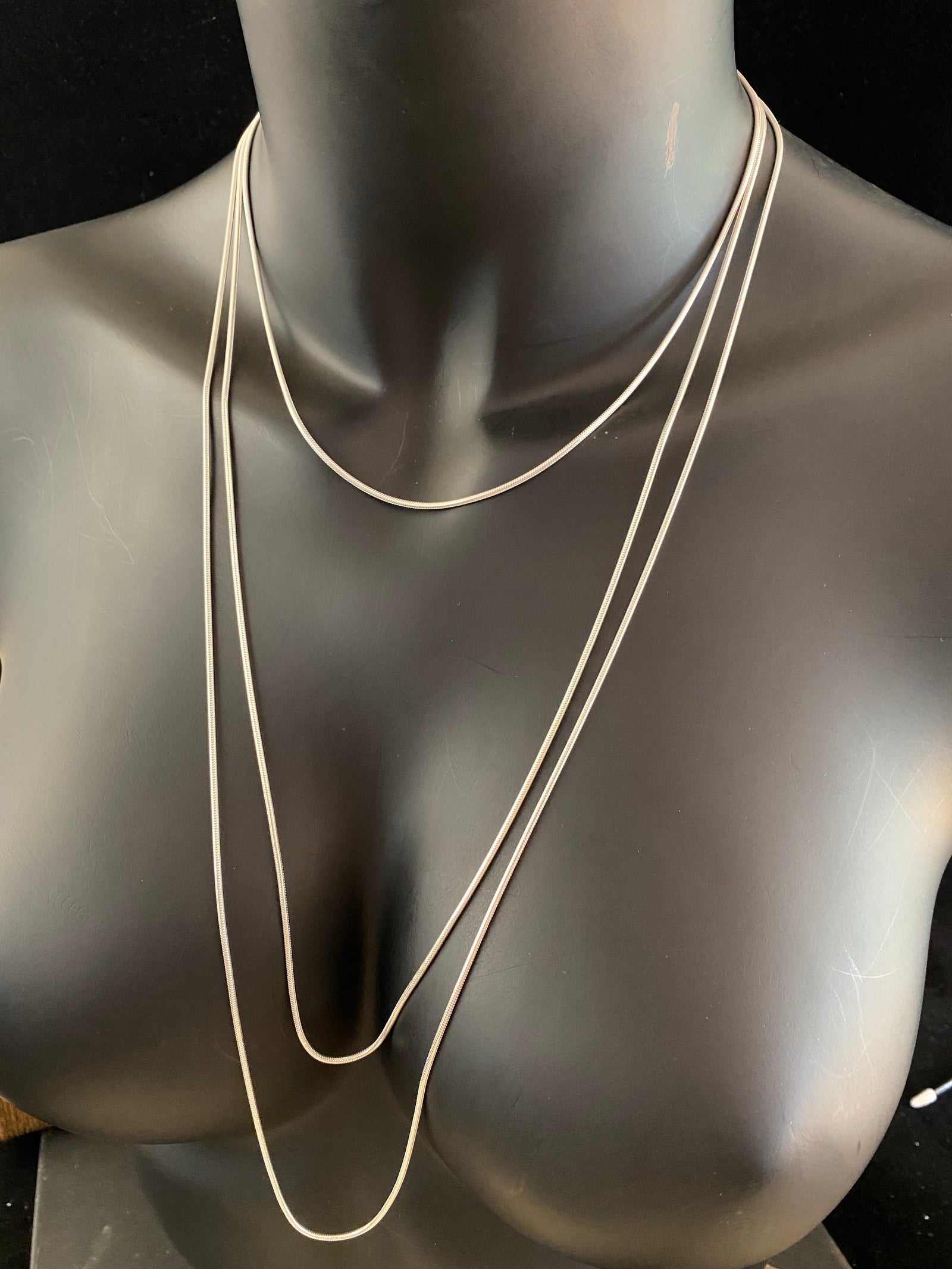 1.4 mm diameter snake chain in three lengths, these nickel-free chains are German-made from 93.5% silver and are tarnish-resistant. Our snake chain features a parrot clasp and is fitted with a narrow bail to ensure even the smallest of pendants will fit. Select Medium 45 cm/18", Long 70 cm/28" or Very long - 80 cm/32"