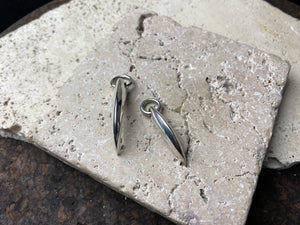 Simple sterling silver claw pendants, complete with large closed jump rings