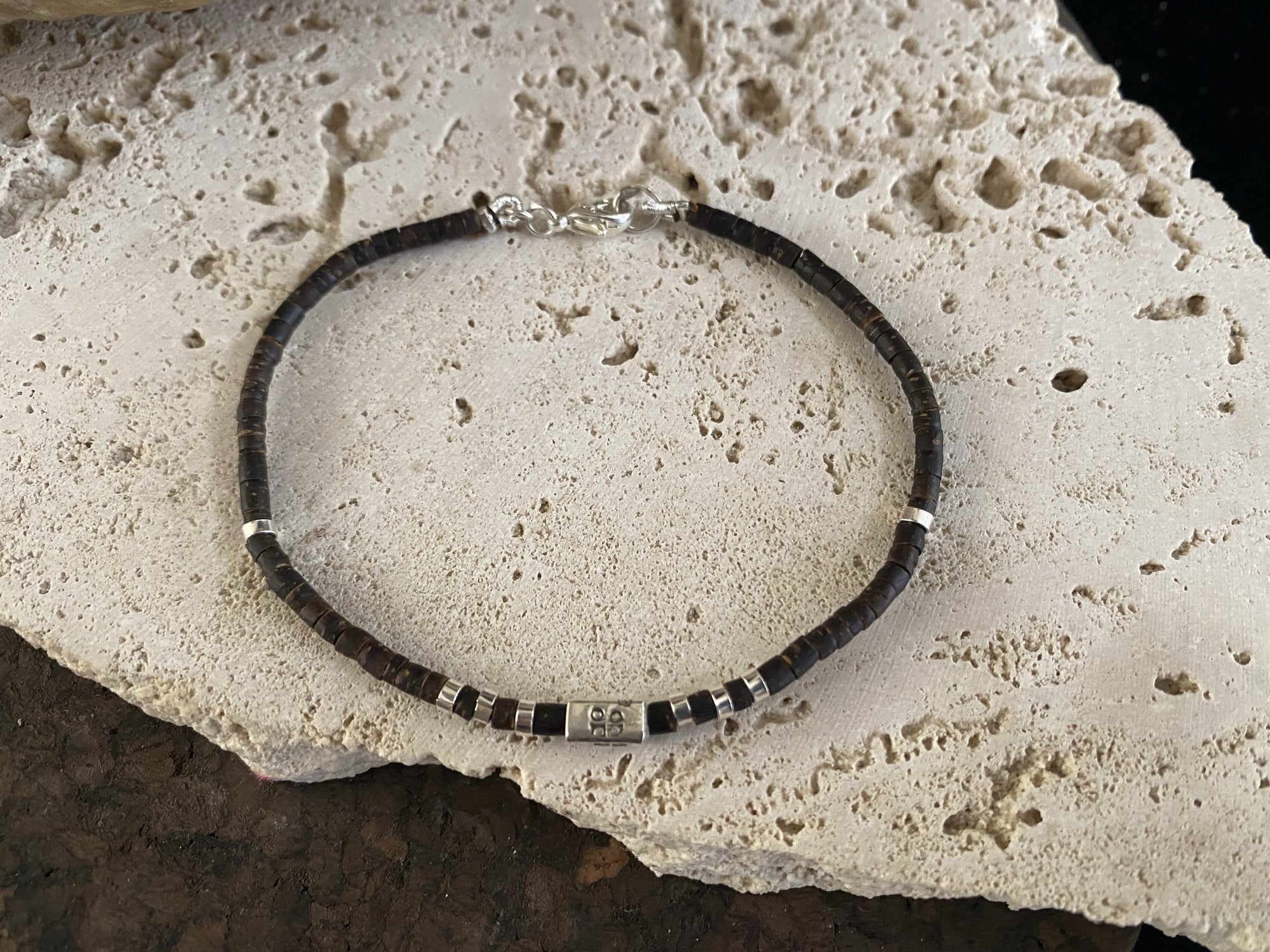 Our signature bracelet style, crafted from polished coconut wood and Karen hill tribe 95% silver. This women or men's bracelet has a casual Boho vibe, is understated, chic and modern, and is made for that stacked bracelet look.