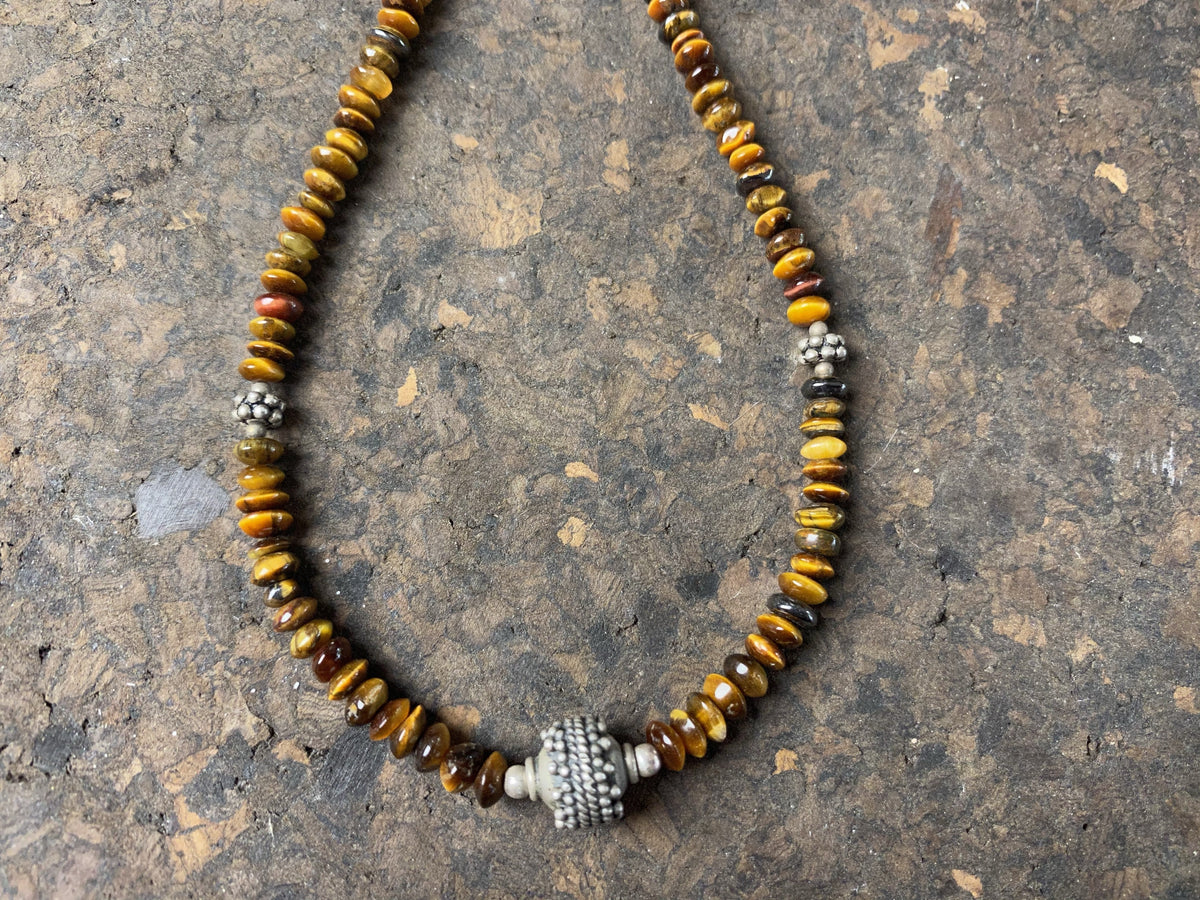 graduated natural tigers eye necklace features a central handmade vintage Indian silver bead and sterling silver detailing