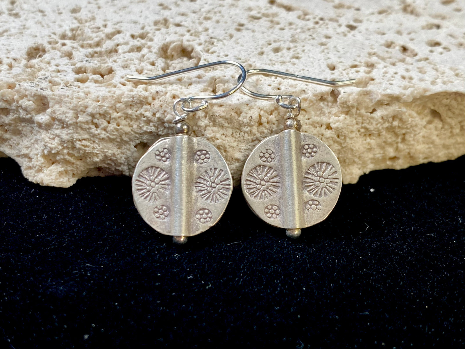 Our most popular earring. Karen hill tribe charms of high grade silver finished with sterling silver hooks.  Charm 1.5 cm diameter, earring length 2.8 cm including hook 