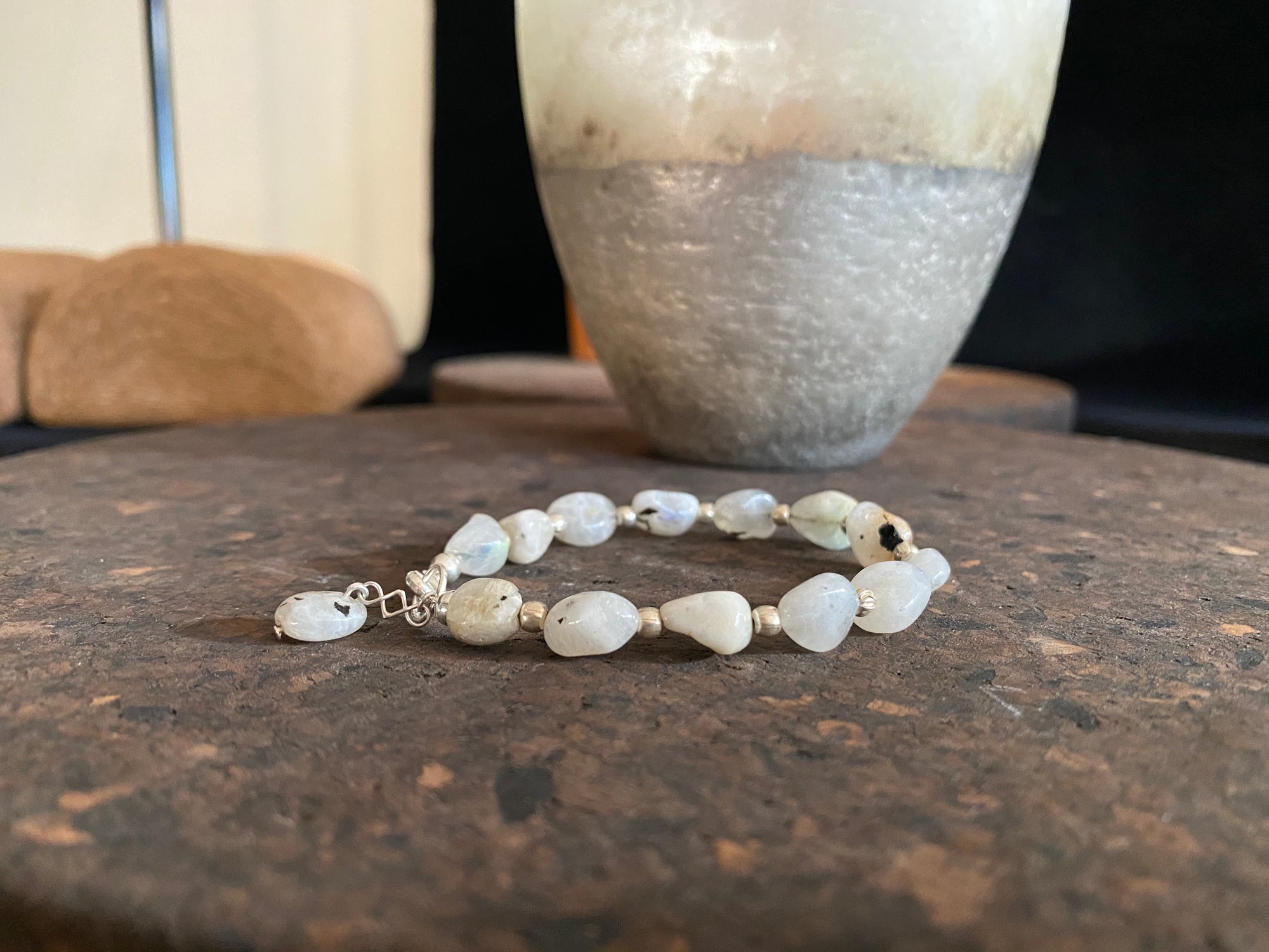 Boho style bracelet made from natural rainbow moonstone stones, finished with sterling silver. A single moonstone drop acts as both a feature to catch the eye and as a counterweight, keeping the bracelet sitting the right way up on the wrist.  18.5 cm length (7.3")