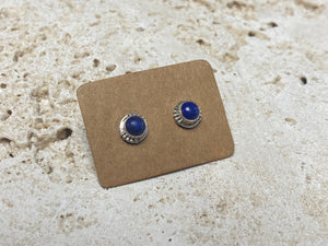 Simple and elegant, these small lapis lazuli earring studs are hand made from sterling silver and set with lapis cabochons