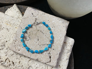 natural sky blue turquoise bracelet finished with sterling silver beads and clasp for casual styling. Length 18.5 cm