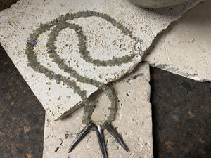 Necklace of rounded labradorite chip stones set with three tribal Pāua pendants designed to highlight the iridescent quality of the natural stone. This necklace is finished with a sterling silver hook clasp. Length 47.7 cm