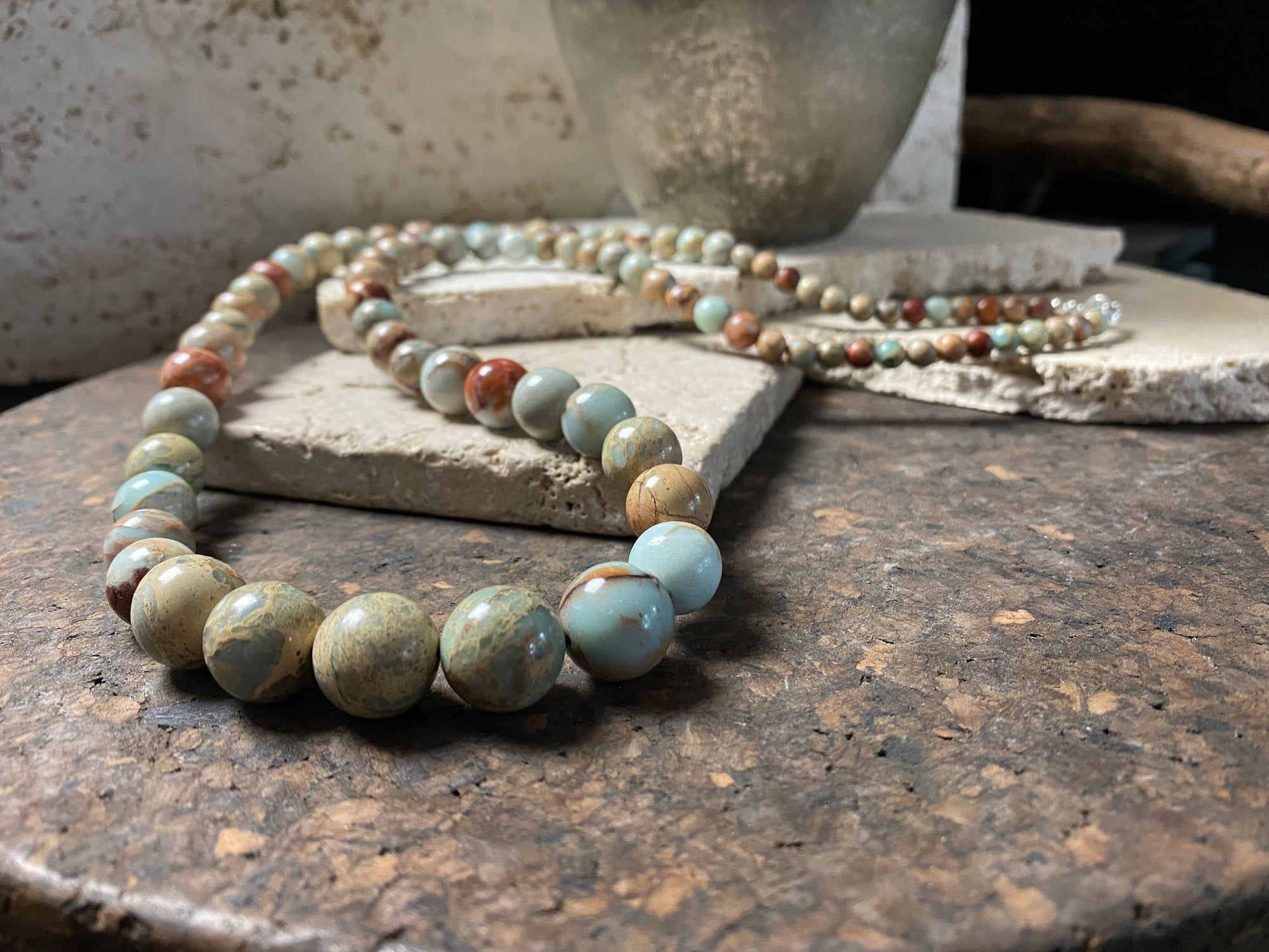 A long necklace made from perfectly matched, graduated Ethiopian opal beads, finished with sterling silver findings. Hook clasp. Measurements: 80 cm (31.5"), largest bead 14 mm diameter, smallest bead 6 mm diameter.