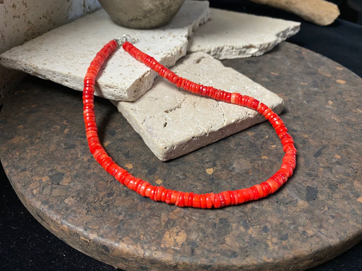 Our simple coral necklace features red coral heshi beads finished with a sterling silver beads and hook clasp. A smart and elegant Southwest style choker that can be worn by men or women.  Bamboo coral is dyed and responsibly sourced from the Pacific Ocean. Length 45 cm (17.75"), diameter of beads 7 mm