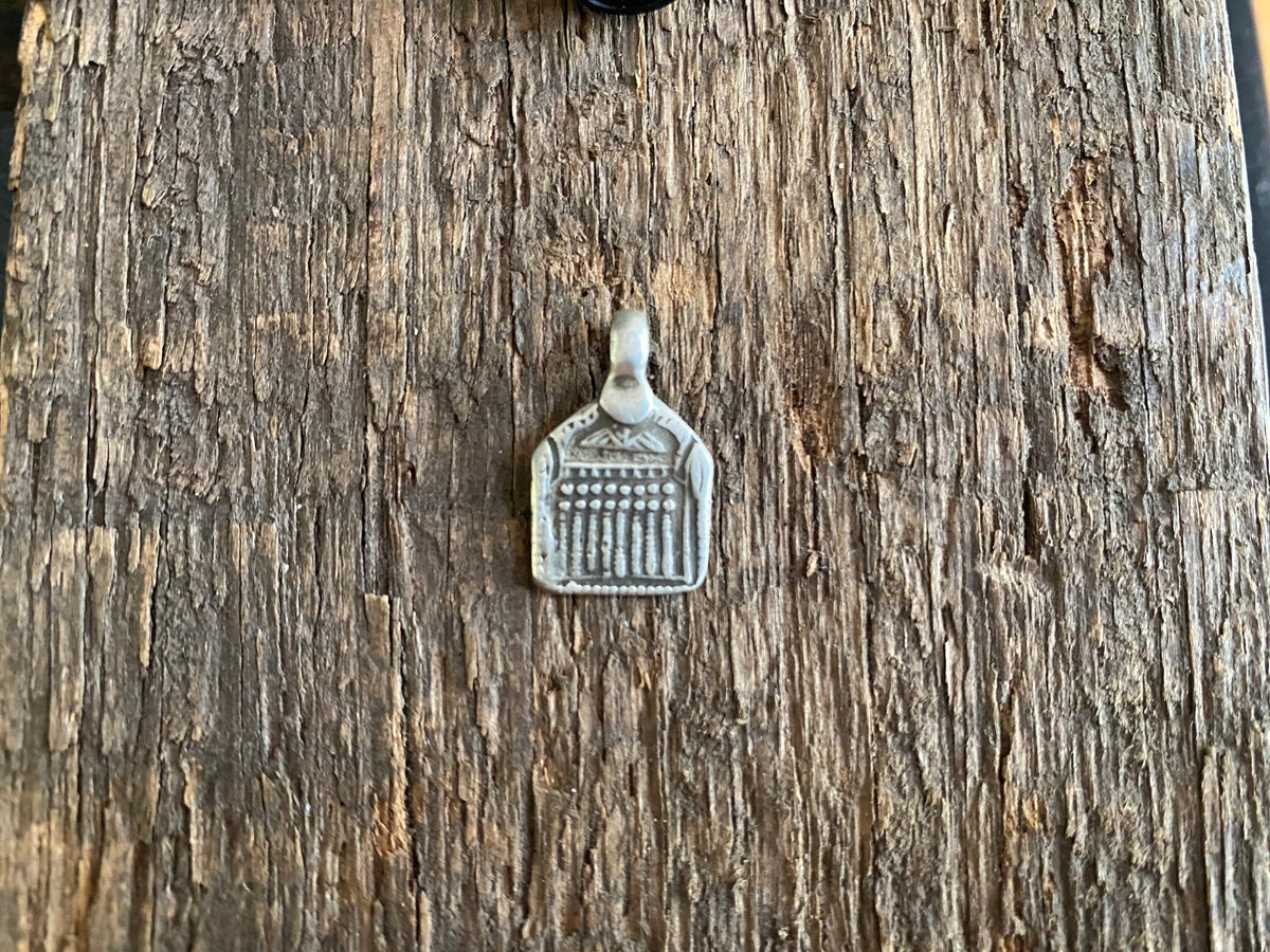 Antique silver amulets representing the Hindu god Skanda and the seven mothers, traditionally worn for protection. Early 19th - early 20th century
