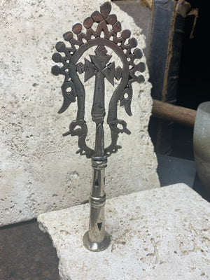 Ethiopian processional cross, hand cast by the lost wax method. Made from white metal and designed to be displayed and paraded in religious processions on top of wooden staffs, these are used vintage pieces dating to the 1970's, and are from the Lalibela region of northern Ethiopia. Height approximately 19.5 cm