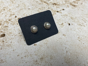 These small pearl studs are hand made from sterling silver and set with natural pearl cabochon stones