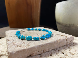 natural sky blue turquoise bracelet finished with sterling silver beads and clasp for casual styling. Length 18.5 cm