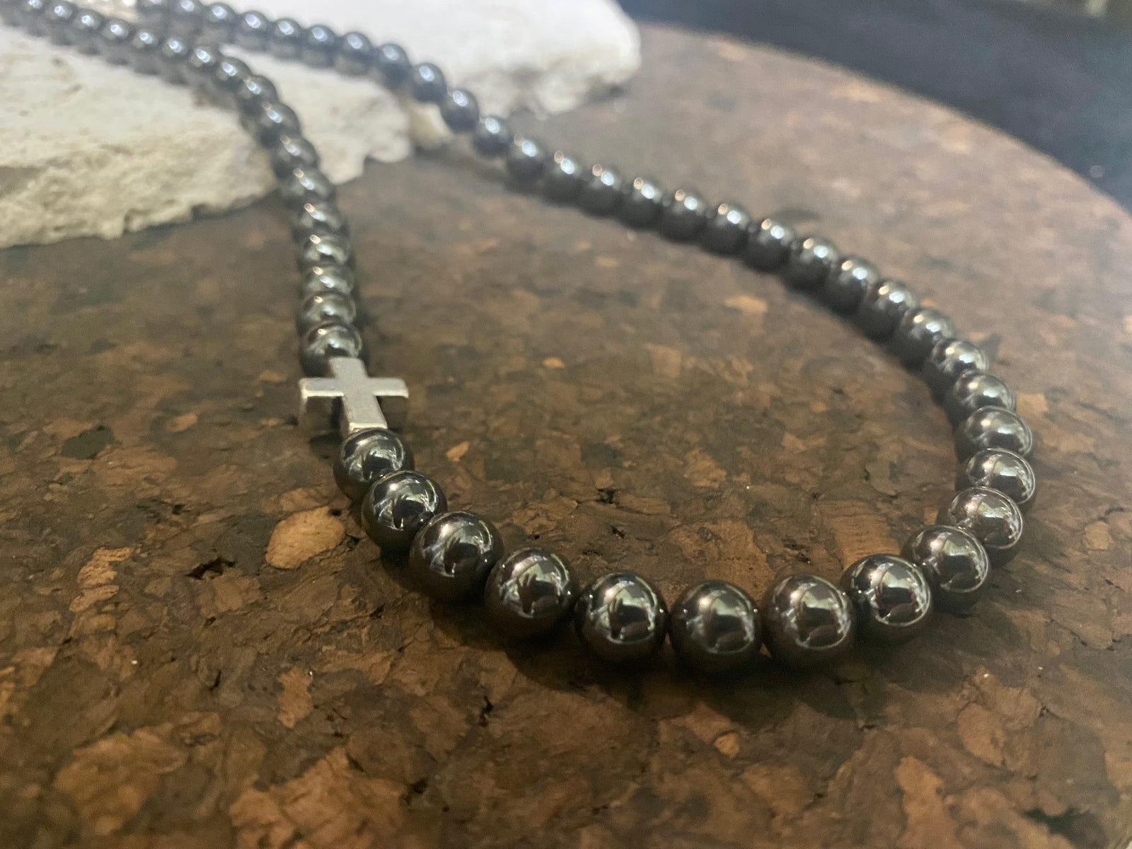Beautiful unisex hematite necklace of perfectly cut round beads highlighted with a silver cross and sterling silver hook clasp. Can be worn by men or women. Length 50.5 cm