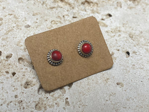 Simple and elegant, these small red coral earring studs are hand made from sterling silver and set with bamboo coral cabochons
