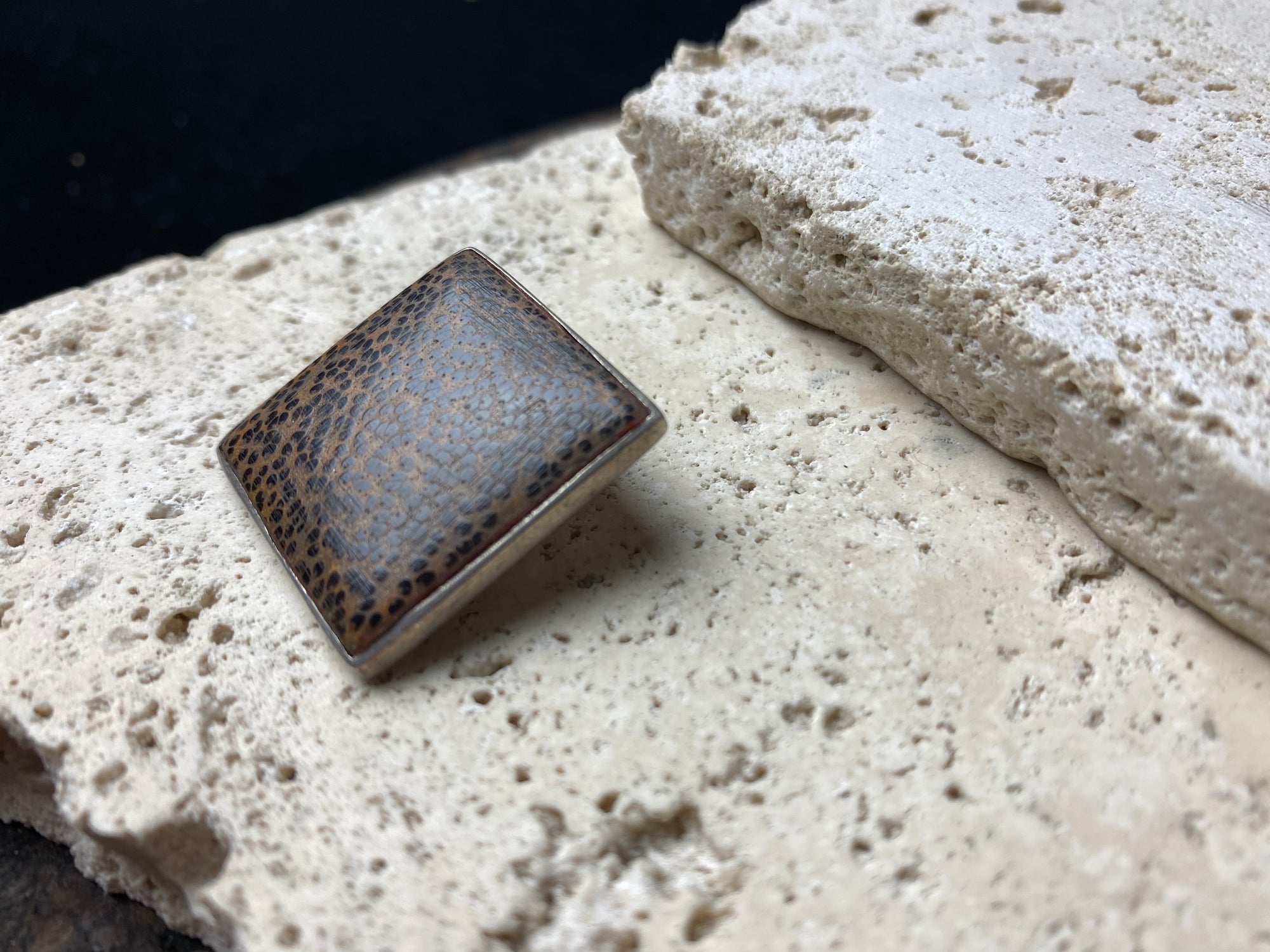 Coconut wood and sterling silver backed square pendant, with a large and generously sized bail that can take not only chains, but cords or leather as well. Can be worn by either men or women.