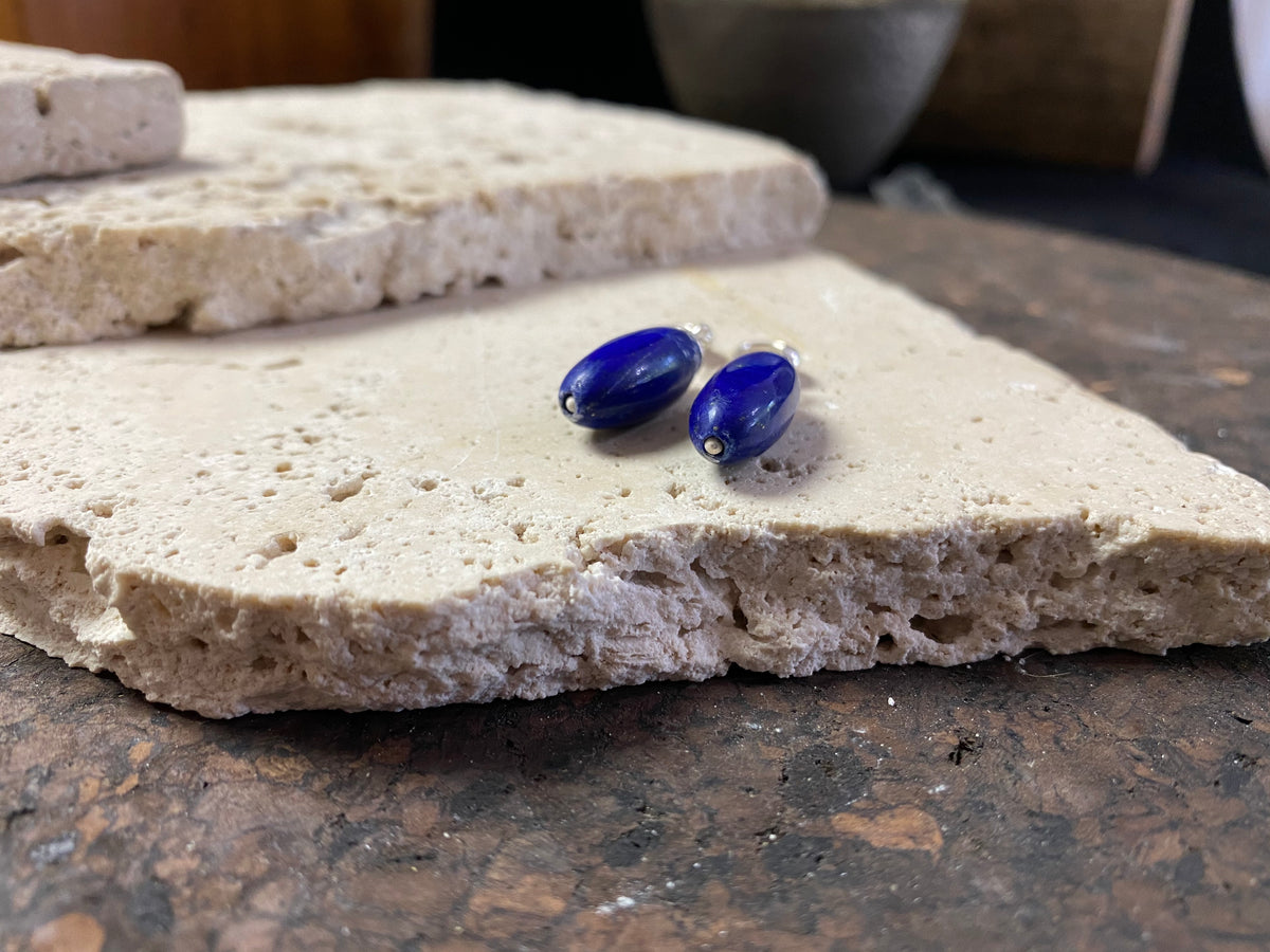 Lapis lazuli natural bead earrings with sterling silver mounts and hooks, finished with small silver beads at the base. and