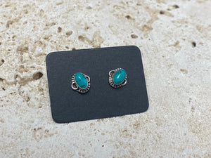 Small natural turquoise earring studs are hand made from sterling silver and set with turquoise cabochons. A unisex earring