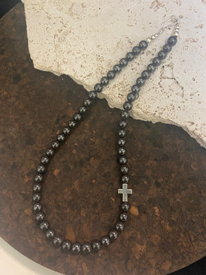Beautiful unisex hematite necklace of perfectly cut round beads highlighted with a silver cross and sterling silver hook clasp. Can be worn by men or women. Length 50.5 cm