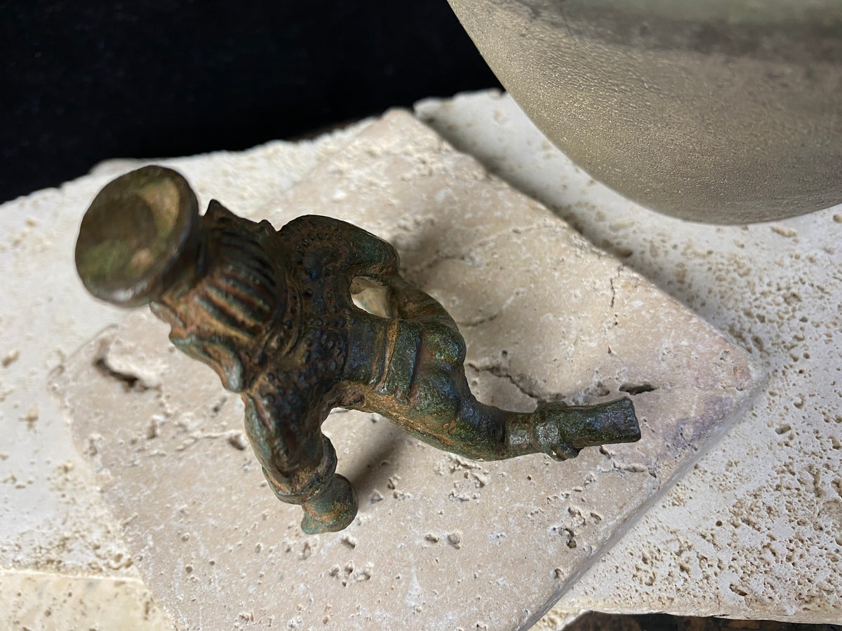 Bal Gopal Krishna. This antique devotional baby Krishna statue is cast from solid bronze, in a crawling posture carrying butter in his hand, 19th century, Orissa Provence, India. This statue has a darkened patina commensurate with its age. Measurements: height 6 cm (2.5"), length 6 cm (2.5")