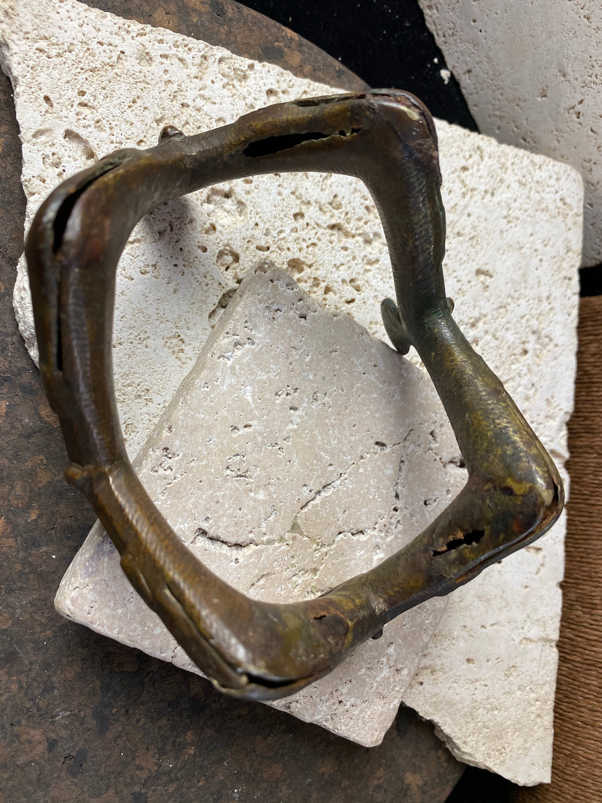 antique upper arm cuff or bracelet, depicting 4 pairs of decorated and bejewelled female arms and hands clasping mirrors. Cast bronze, in excellent condition, showing wear to the inside and underside surfaces