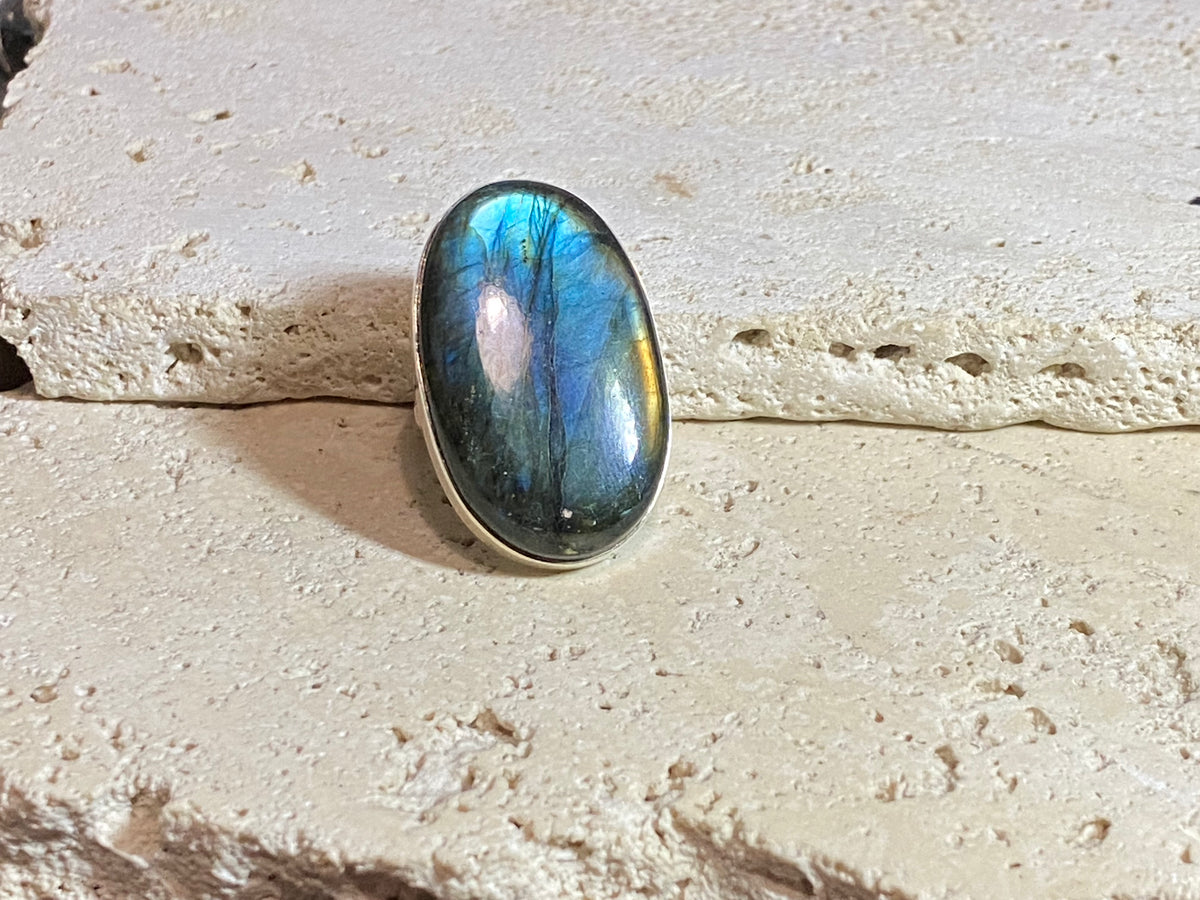 Elegant, large oval cut labradorite ring set in heavy sterling silver. A stunning, high quality stone with excellent fire - one of the best we've ever seen. . Size 7.5