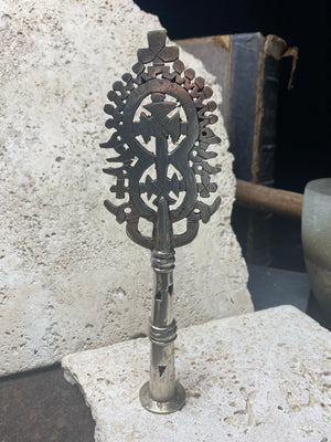 Ethiopian processional cross, hand cast by the lost wax method. Made from white metal and designed to be displayed and paraded in religious processions on top of wooden staffs, these are used vintage pieces dating to the 1970's, and are from the Lalibela region of northern Ethiopia. Height approximately 19.5 cm