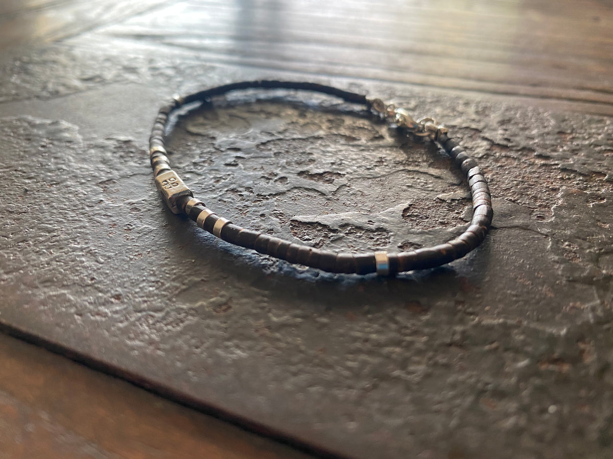 Our signature bracelet style, crafted from polished coconut wood and Karen hill tribe 95% silver. This women or men's bracelet has a casual Boho vibe, is understated, chic and modern, and is made for that stacked bracelet look.