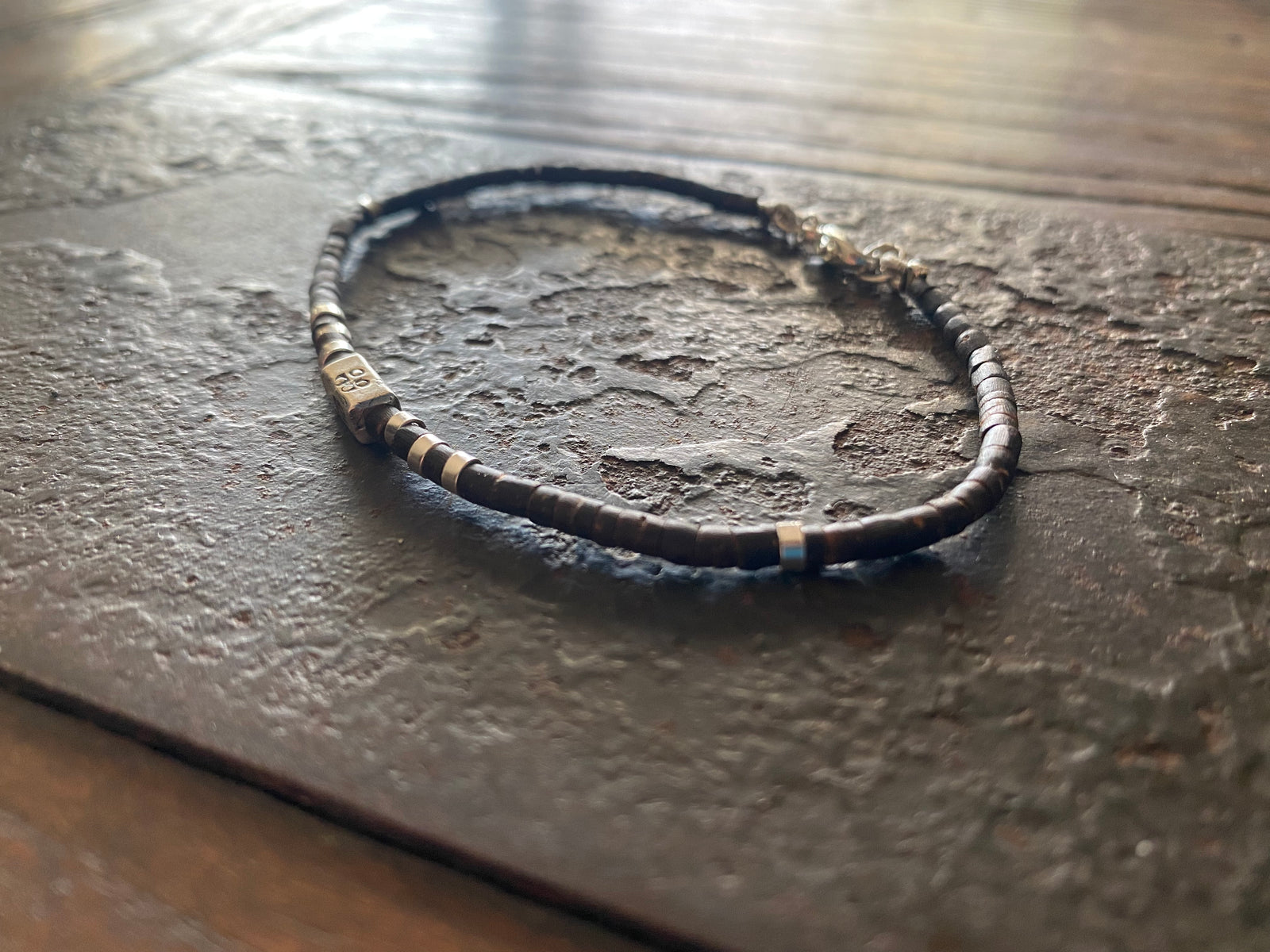 Our signature bracelet style, crafted from polished coconut wood and Karen hill tribe 95% silver. This women or men's bracelet has a casual Boho vibe, is understated, chic and modern, and is made for that stacked bracelet look.
