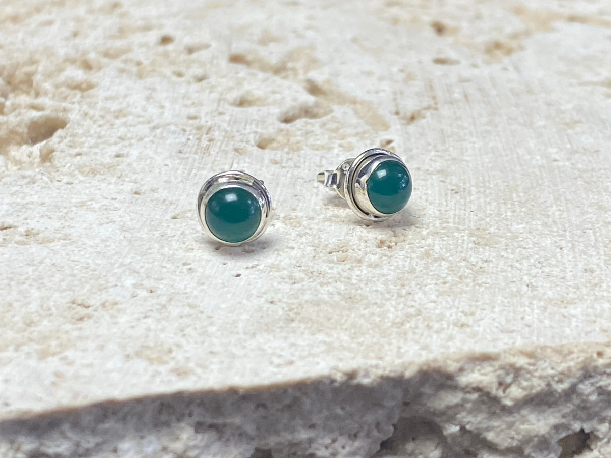 Small chrysoprase earring studs are hand made from sterling silver and set with clear green chrysoprase cabochons. A unisex earring