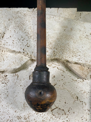 A typical village opium pipe, used by a number of hill tribe people within the Golden Triangle of southeast Asia. This is most likely Hmong.  Bamboo shaft, earthenware smoking bowl. Metal tool used to apply opium is original to the pipe. Early 20th century. In good condition with no cracks or repairs.  Total length 36 cm (14.25")