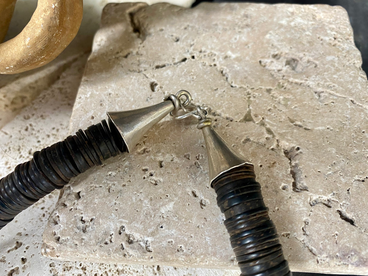 Statement necklace with an African vibe. Made from vintage wood heshi beads and Arizona turquoise, highlighted with vintage ostrich eggshell beads. The necklace is finished with handmade silver cone ends and a generous hook clasp. length 57 cm