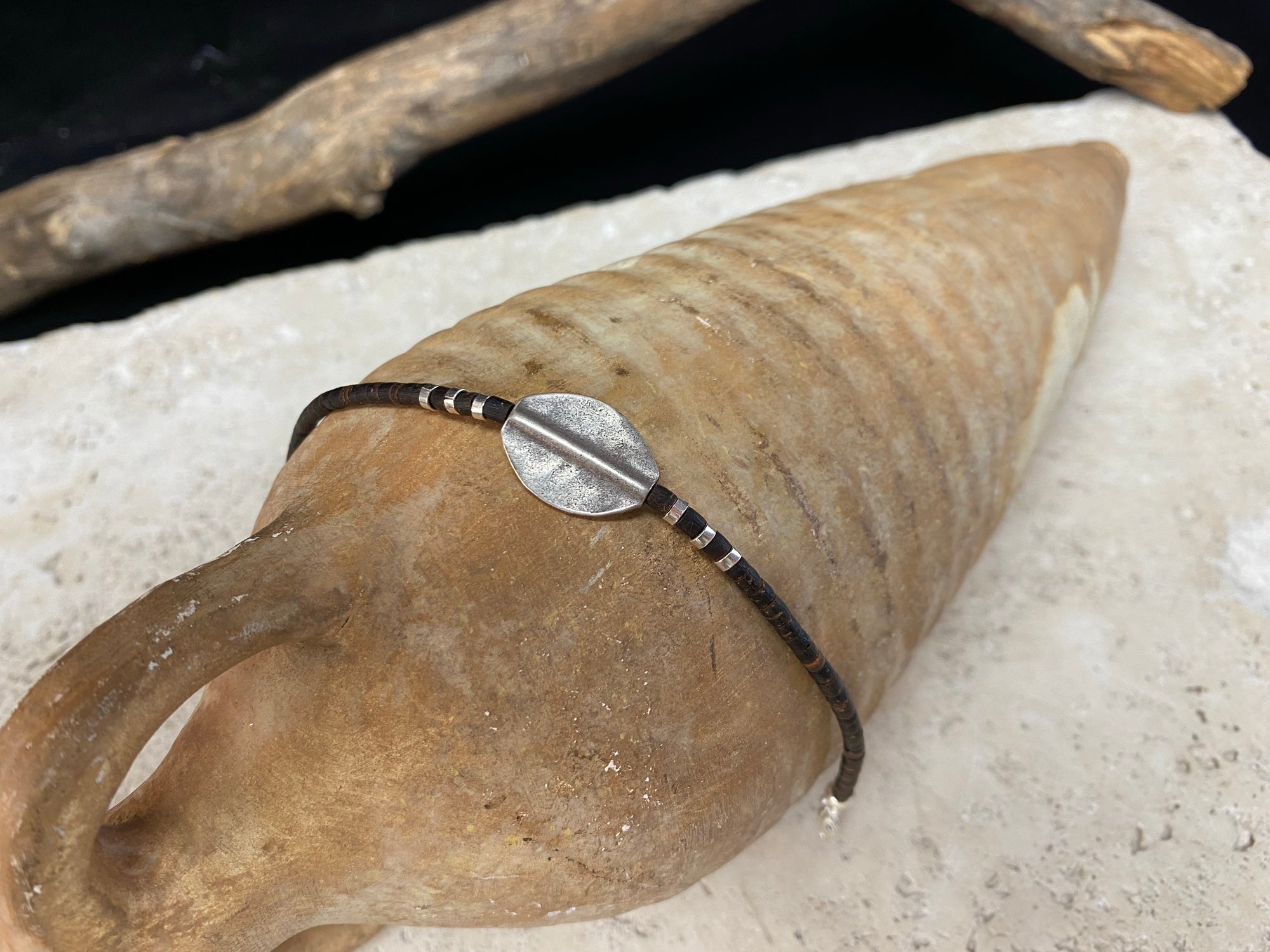 One of our signature coconut silver bracelets, crafted from polished coconut wood and hill tribe 95% silver., with sterling silver lobster clasp. A women's bracelet or a men's bracelet, it has a casual Boho vibe, and is made for that stacked bracelet look. Different sizes available