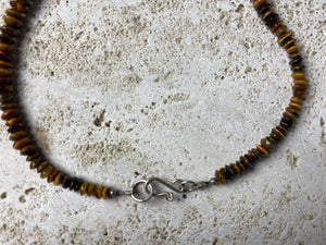 graduated natural tigers eye necklace features a central handmade vintage Indian silver bead and sterling silver detailing