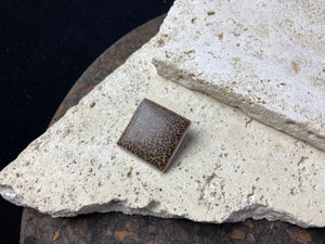 Coconut wood and sterling silver backed square pendant, with a large and generously sized bail that can take not only chains, but cords or leather as well. Can be worn by either men or women.