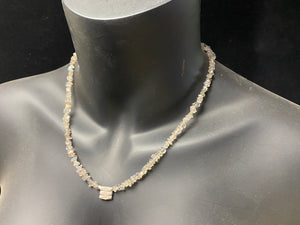 Necklace of rounded labradorite chip stones highlighted with sterling silver spacers and set with a beautiful silver tribal pendant. %0 cm length