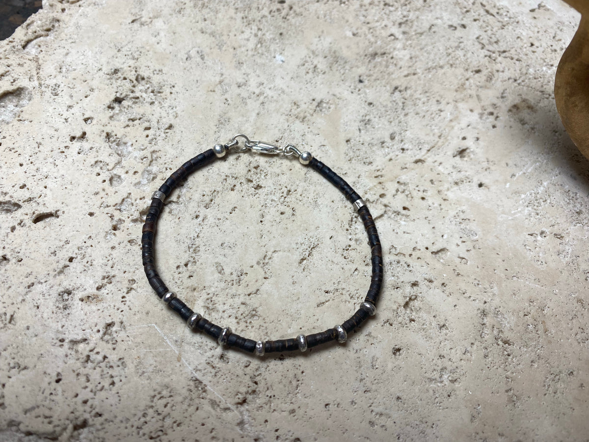 One of our signature coconut silver bracelets, crafted from polished coconut wood and hill tribe 95% silver., with sterling silver lobster clasp. A women's bracelet or a men's bracelet, it has a casual Boho vibe, and is made for that stacked bracelet look. Different sizes available