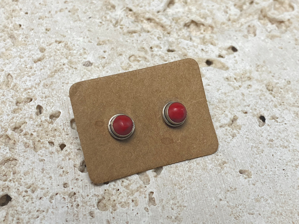 Simple and elegant, these small red coral earring studs are hand made from sterling silver and set with bamboo coral cabochons