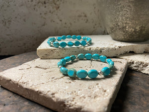 Blue stone bracelet with sterling silver bead detailing. Elasticised stringing for a seamless look.