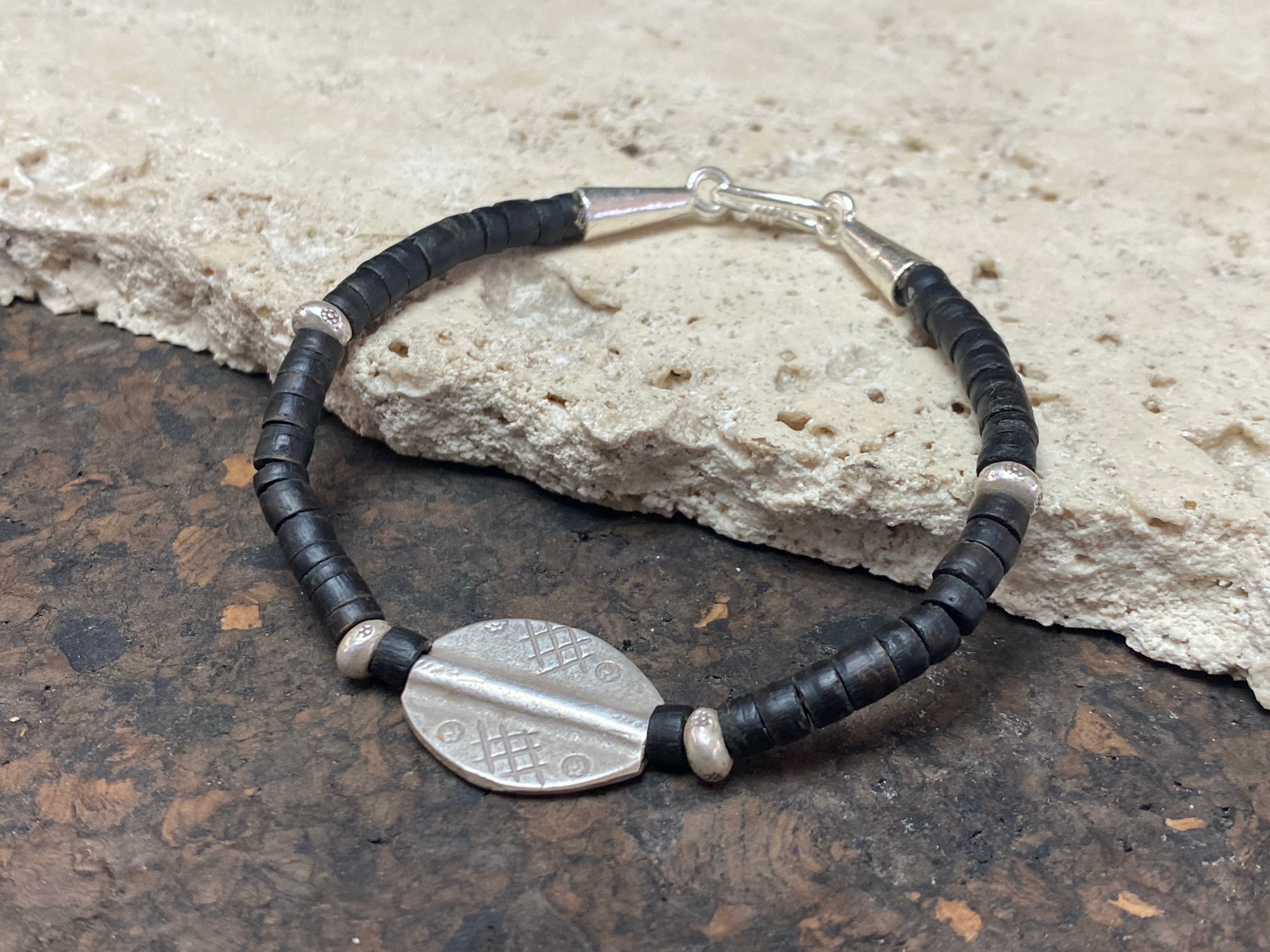 One of our signature coconut silver bracelets, crafted from polished coconut wood and hill tribe 95% silver A women's bracelet or a men's bracelet, it has a casual Boho vibe, and is made for that stacked bracelet look. Different sizes available