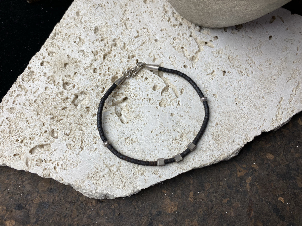 Our women or men's bracelet is made from fine cut coconut wood and hilltribe 95% pure silver. This Boho style bracelet is made from coconut wood beads and hill tribe 95% silver. Our tribal bracelets are understated, chic and modern, and are made for that stacked bracelet look.