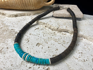 Statement necklace with an African vibe. Made from vintage wood heshi beads and Arizona turquoise, highlighted with vintage ostrich eggshell beads. The necklace is finished with handmade silver cone ends and a generous hook clasp. length 57 cm