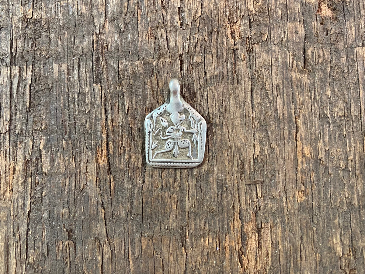 Antique silver amulets representing the Hindu god Hanuman, traditionally worn for protection and good luck. Originating in southern India, and dating from the early 19th - early 20th century.  All vary between 1.4 and 1.7 cm in width