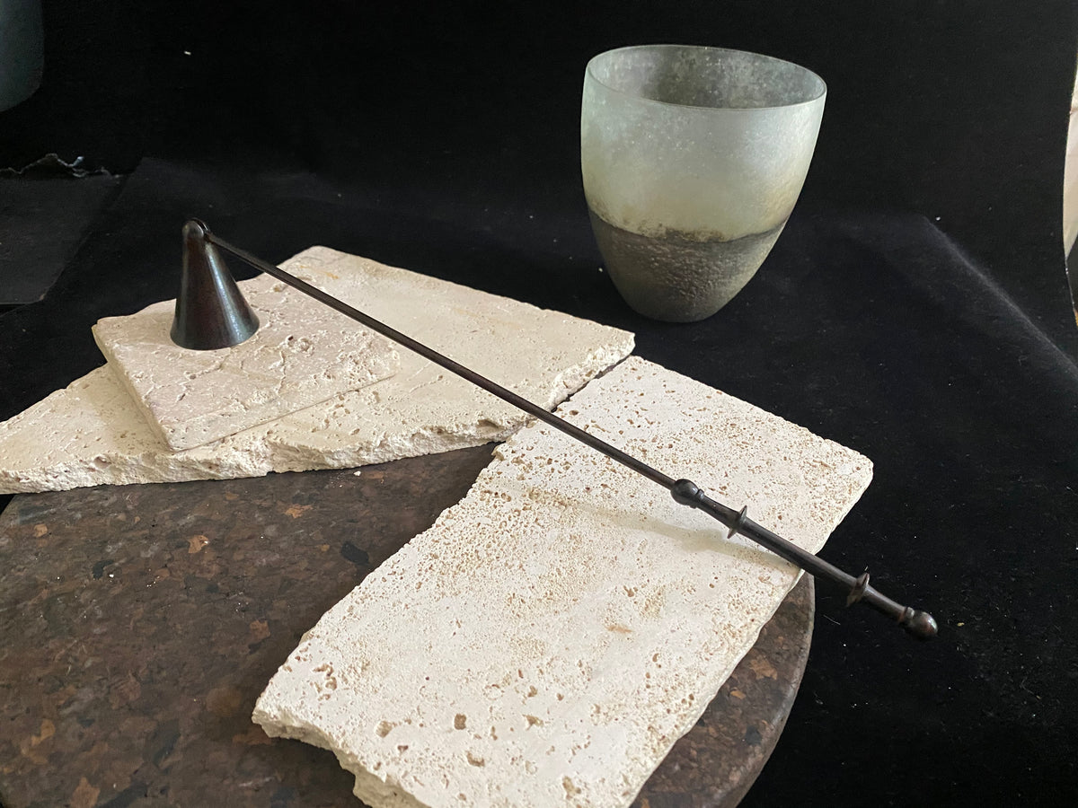 Metal candlesnuffer in bronze finish with a swivel head. Practical and stylish with a comfortable grip and swivel head to allow a candle to be snuffed from all angles. Measurements: 35 cm (13.77") length, stick length 31 cm (12.2)