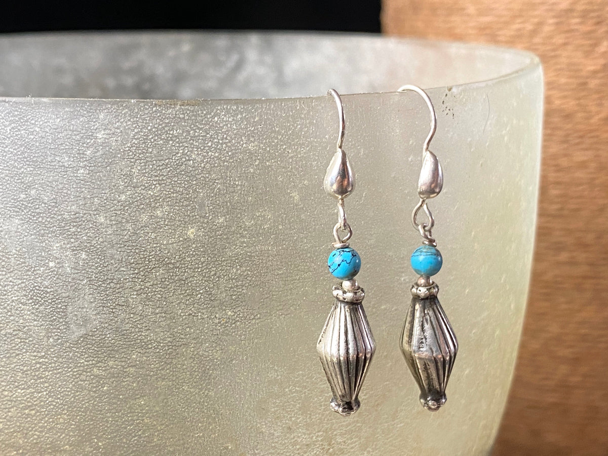 Vintage silver bead from India is teamed up with genuine American turquoise to create a beautiful boho drop earring