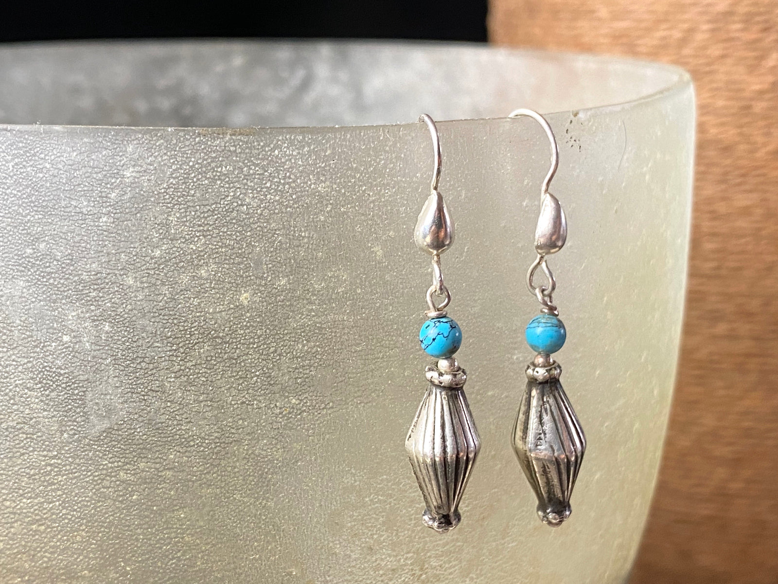 Vintage silver bead from India is teamed up with genuine American turquoise to create a beautiful boho drop earring