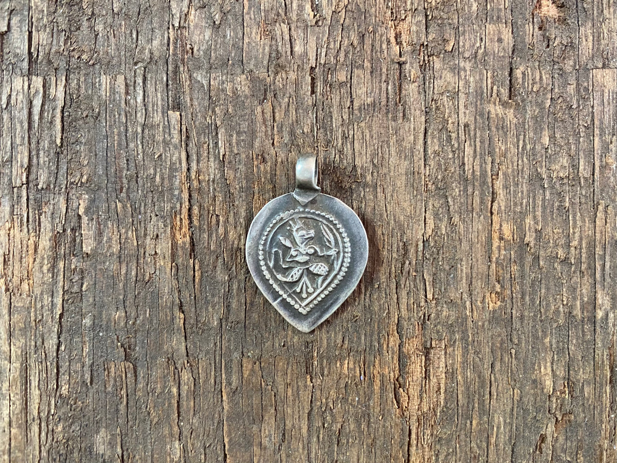 Antique silver amulets representing the Hindu god Hanuman, traditionally worn for protection and good luck. Originating in southern India, and dating from the early 19th - early 20th century.  All vary between 1.4 and 1.7 cm in width